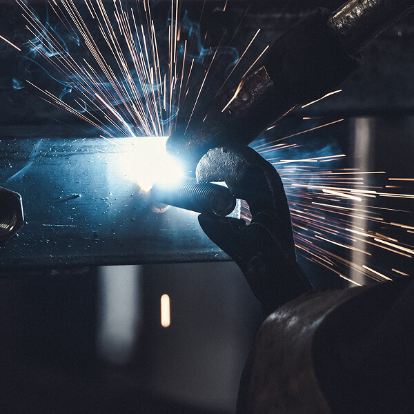 Welder working in an industrial facility